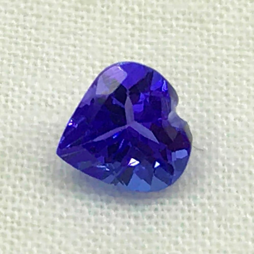 .86ct Tanzanite Heart of Love Faceted Gemstone: .86ct Tanzanite Heart of Love Faceted Gemstone Tanzanite beautiful gemstone heart shaped , Size- 6 mm, Weight- 0.86 ct View photo for further details.