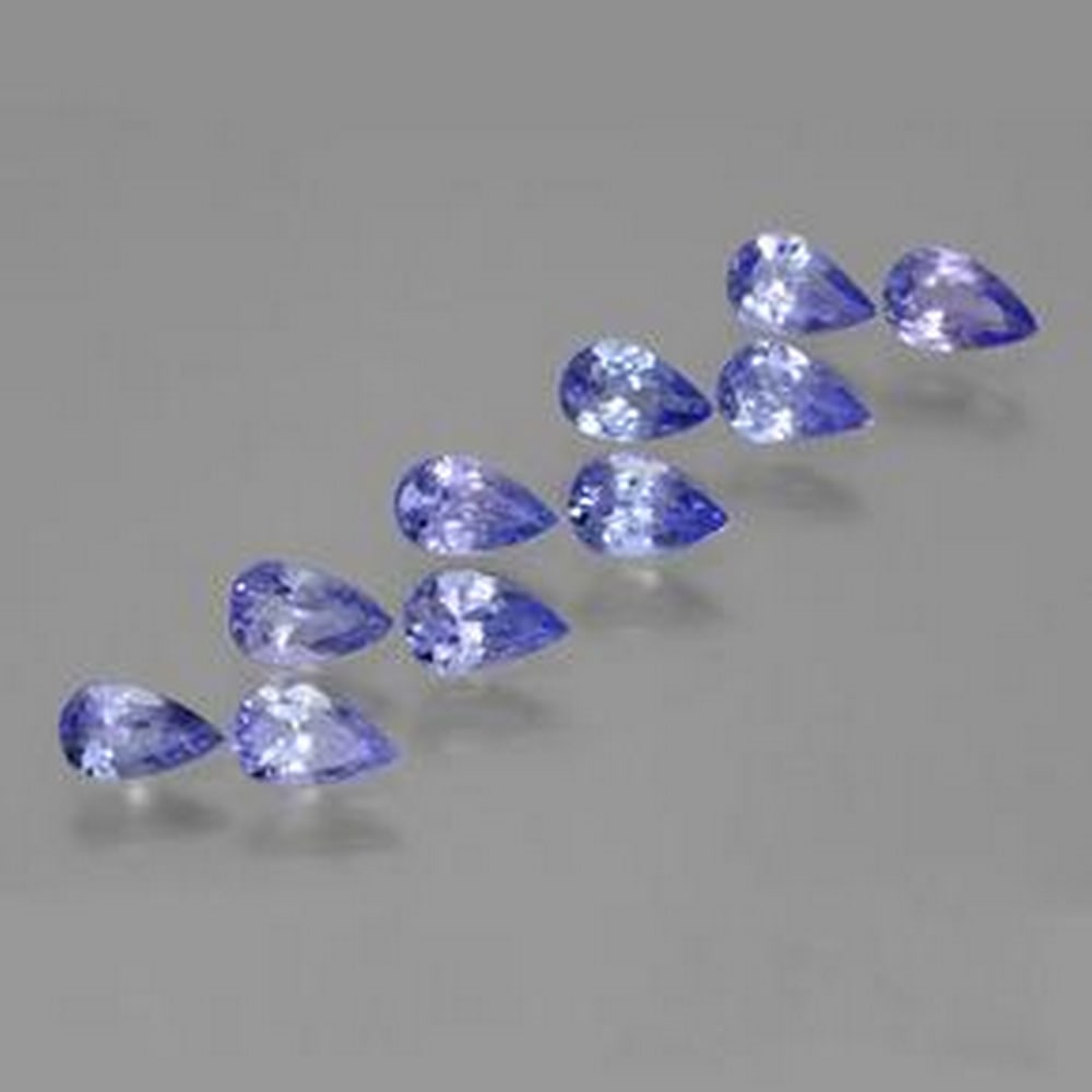 3.35ct Pear Cut Violet Blue Tanzanite Lot: 3.35ct Pear Cut Violet Blue Tanzanite Lot Lot Contains 10 Gemstones Size: 5.8mm x 3.7mm x 2.5mm Total Carat Weight: 3.35ct Individual Carat Weight: Approximately 0.33ct Clarity: VS Treatment: Heated O