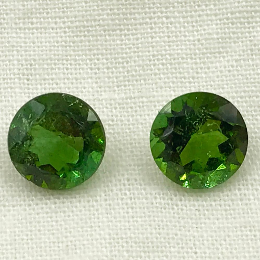 2.65ct Green Tourmaline Round Faceted Pair Gemstones: Green Tourmaline Round Faceted Pair Majestic Green Tourmaline, round pair for earrings, Size- 7 mm, Weight- 2.65 ct View photos for further details.