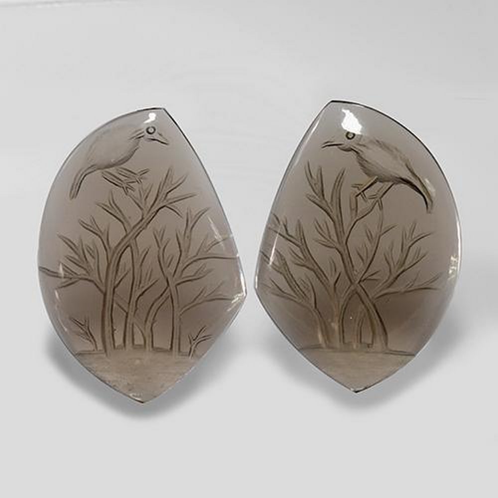 2pc Matching Fancy Brown Smoky Quartz 75.9ct Total ct Weight: 2pc Matching Fancy Brown Smoky Quartzs These matching pieces are perfect for a earing set for a loved one. Smoky Quartz brings emotional calmness to your spirit and soul. Smoky quartz helps one to rel