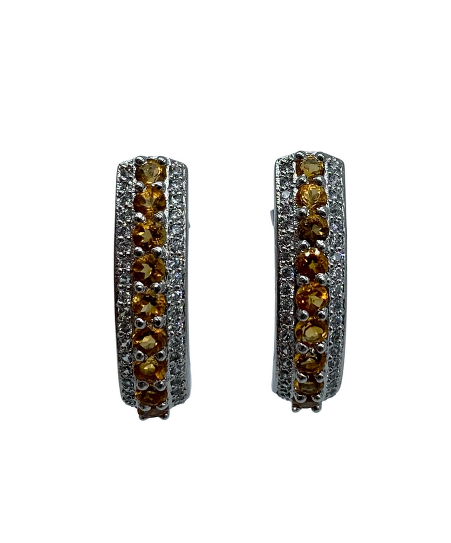 925 Sterling Silver Citrine Gemstone Earrings: 925 Sterling Silver Citrine Gemstone Earrings These earrings have citrine gemstones along the entire earring and have Austrian crystals on both sides. View photos for further details.