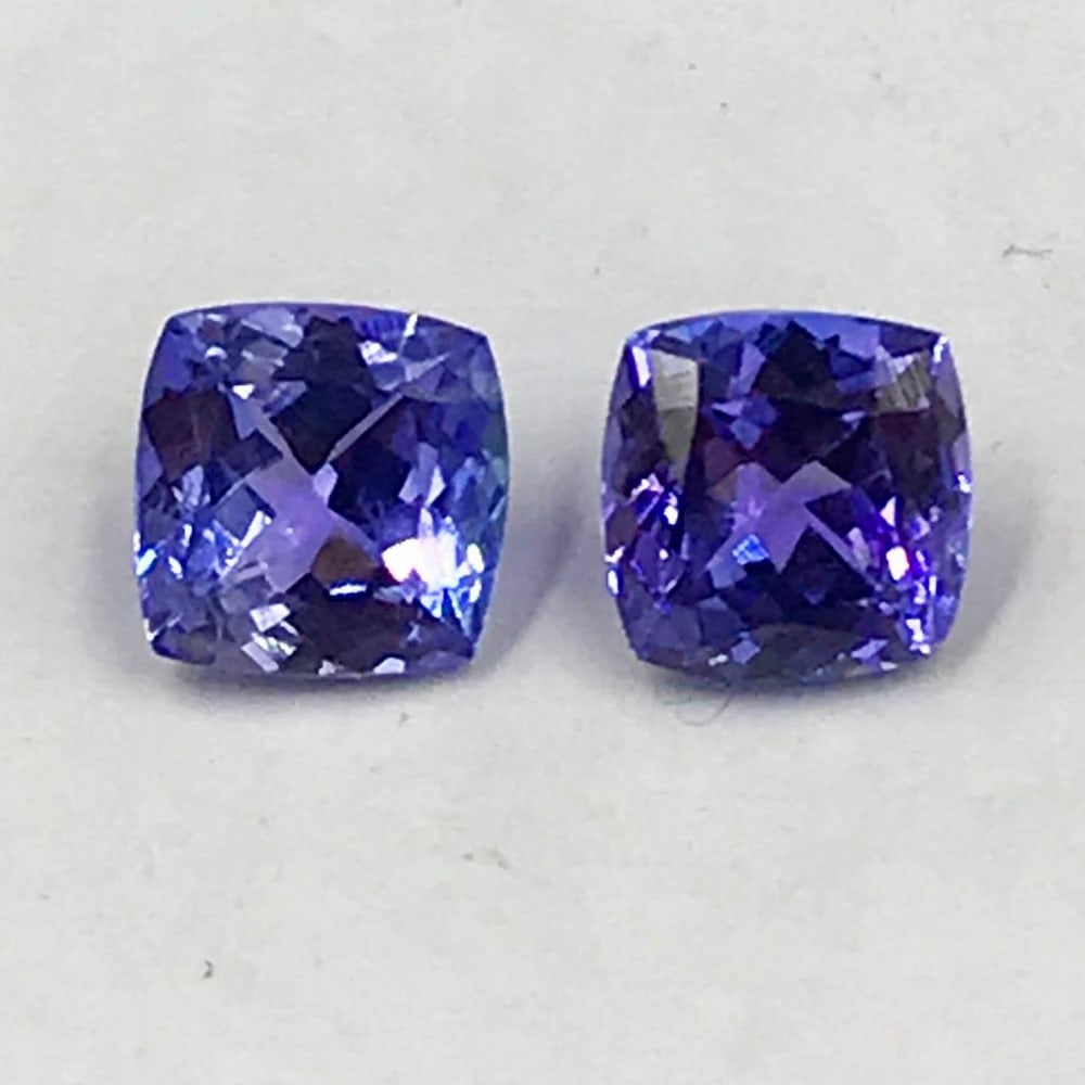 1.53ct Pair of Faceted Cushion Tanzanite Gemstones: Pair of Faceted Cushion Tanzanites Tanzanite gems are believed to represent heart and intellect combined with intuition and purity. These stones are used as symbols of dignity, truth, judgement and