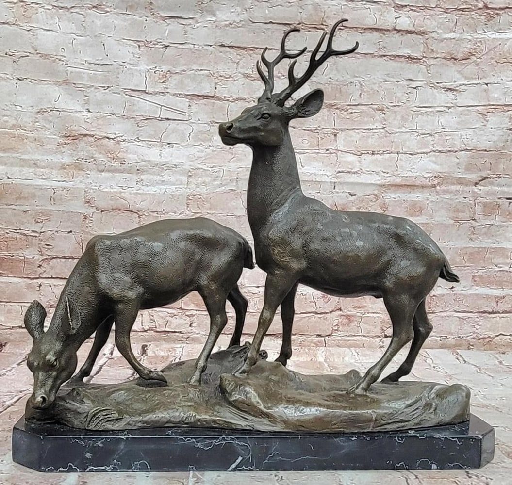 Male and Female Deer Bronze Statue – 15.5" x 17": Male and Female Deer Bronze Statue – 15.5" x 17" This original bronze statue depicts a male and female deer in a serene moment of natural harmony, with the stag standing alert beside the gen