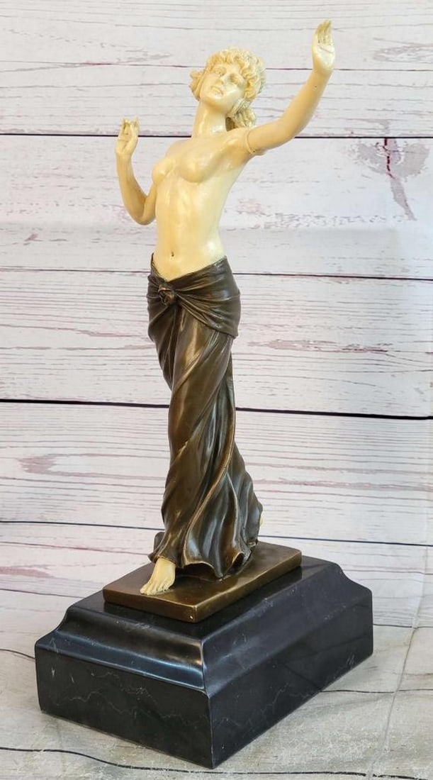 Topless Dancing Women Inspired Bronze Statue - 14.5" x 7": Topless Dancing Women Inspired Bronze Statue - 14.5" x 7" This finely sculpted statue portrays a topless woman dancing with grace, wearing a long skirt that cascades beautifully around her wai