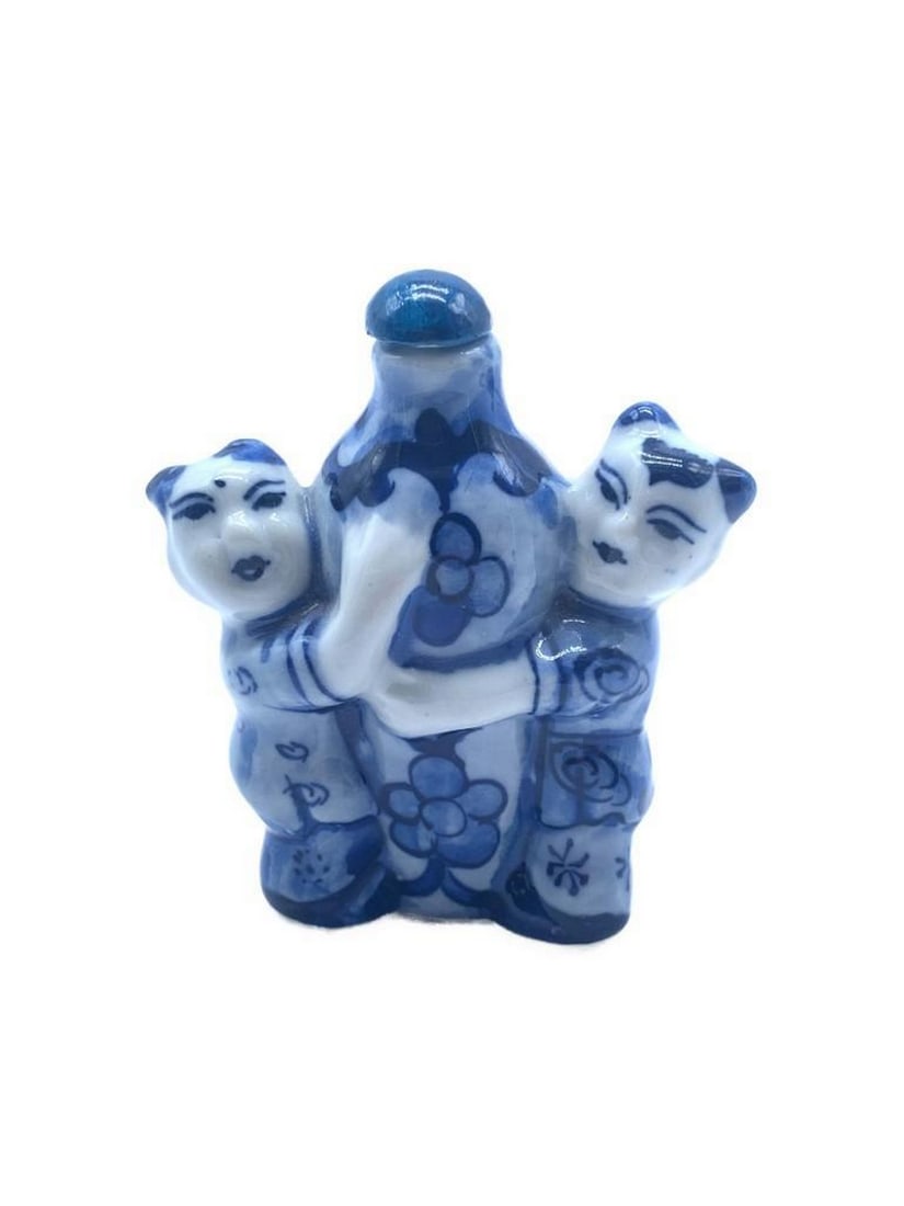 Vintage Hand Painted Porcelain Snuff Bottle from Taiwan: Introducing a captivating work of art, This Porcelain Snuff Bottle featuring an enchanting portrayal of two Taiwanese ladies embracing the bottle. This exquisite snuff bottle transcends mere