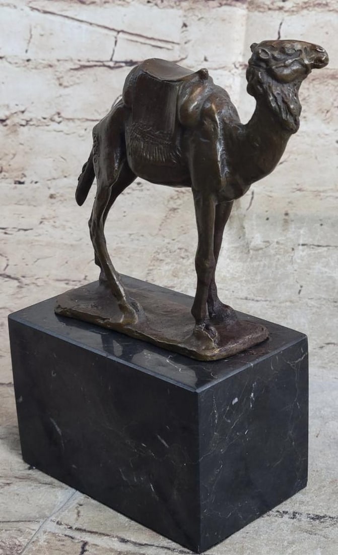 TRAVELLING CAMEL BRONZE SCULPTURE ON MARBLE BASE - 9" X 8": Travelling Camel Bronze Sculpture On Marble Base - 9" x 8" This Camel looks like he is ready to take a journey through the rough dessert but he’s not worried because he knows he will be hydr