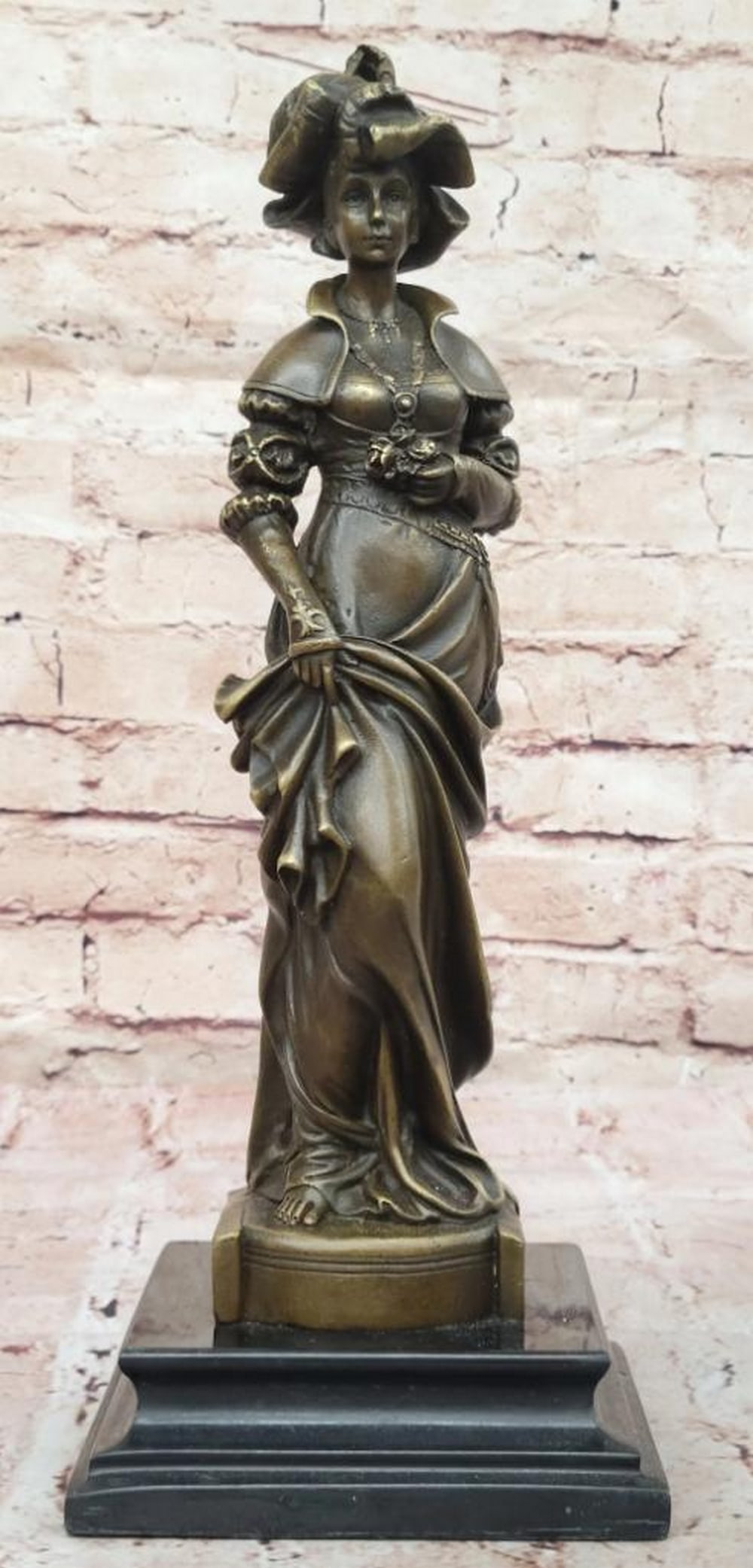 Signed Bronze Sculpture by Ceribelli of Woman with Large Hat and Flower - 14" x 5": Signed Bronze Sculpture by Ceribelli of Woman with Large Hat and Flower - 14" x 5" This exquisite bronze sculpture by Ceribelli beautifully captures the timeless grace of a Victorian woman ado