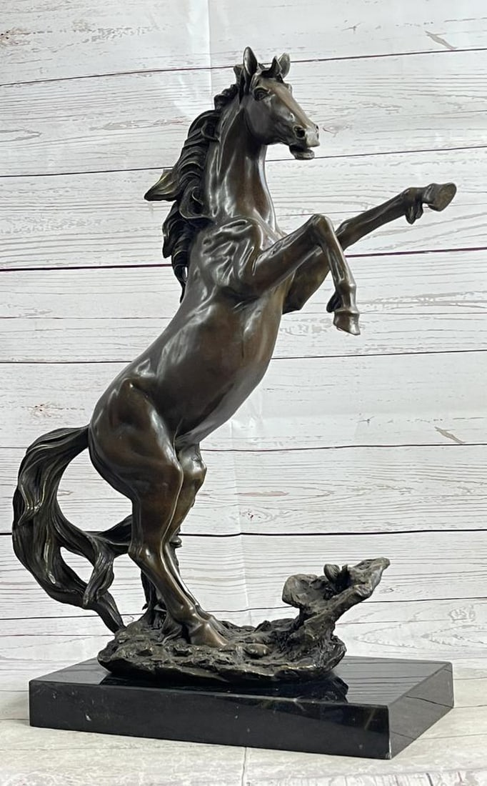 Rearing Horse Bronze Sculpture by Fisher - 22" x 19": Rearing Horse Bronze Sculpture by Fisher - 22" x 19" This striking bronze sculpture captures the raw power and emotion of a rearing horse, frozen in a moment of wild intensity. With its mouth 