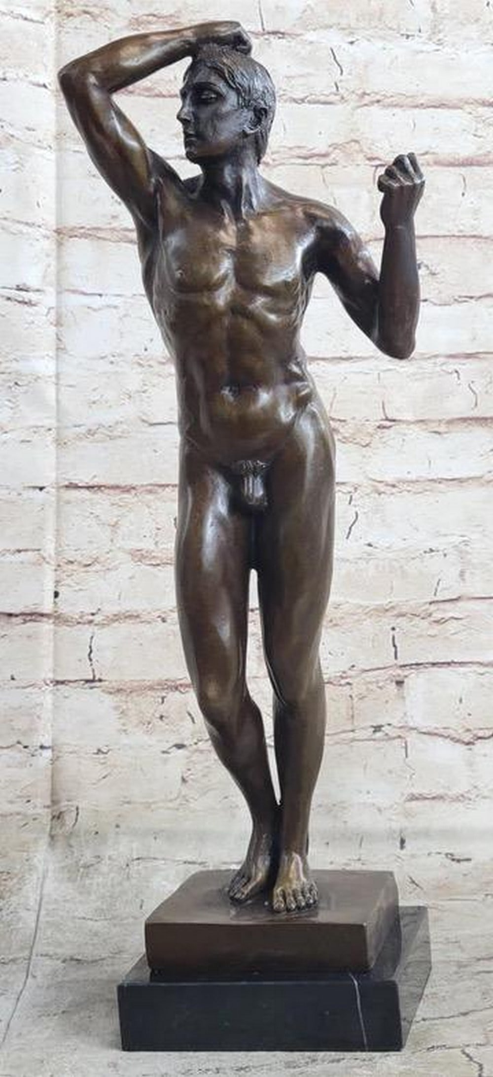 Posing Nude Man Inspired Bronze Statue - 18'' x 8'': Posing Nude Man Inspired Bronze Statue - 18" x 8" This captivating bronze sculpture depicts a tranquil nude man in a serene moment, bathed in morning sunlight from an open window. Reflecting dre