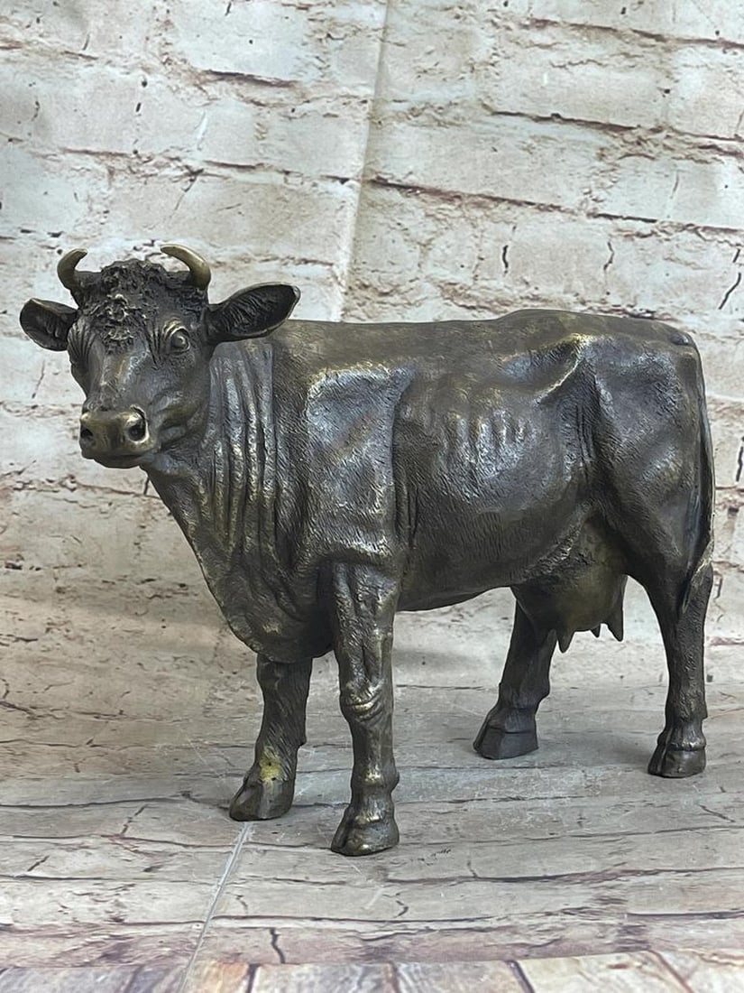 Signed Milo Original Female Cow Bronze Sculpture - 9'' x 11'': Signed Milo Original Female Cow Bronze Sculpture - 9" x 11" The female cattle trots along the grassy fields she calls home. Her horns protrude out from the top of her head. The muscles in her bo