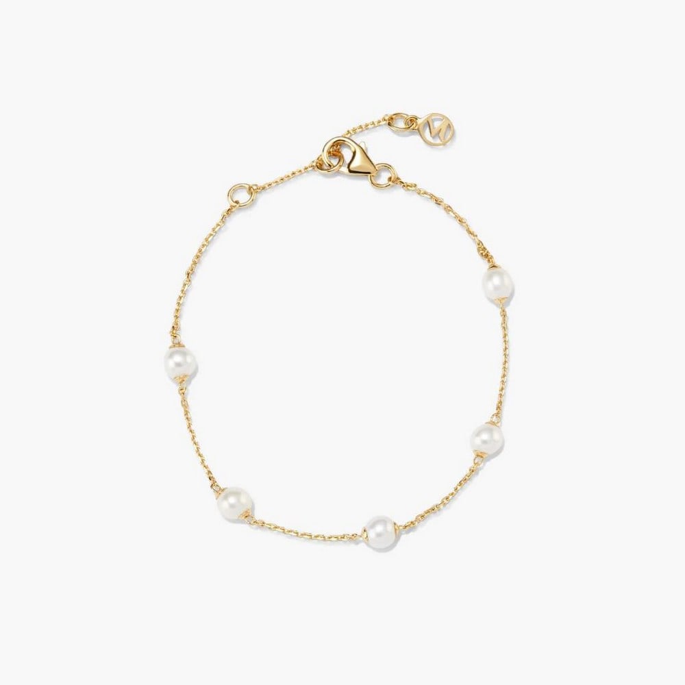 18k Gold Vermeil Floating Pearl Bracelet: 18k Gold Vermeil Floating Pearl Bracelet A delicate 18k gold vermeil chain adorned with freshwater pearls for a subtle, elegant touch. Lightweight and versatile, it can be worn alone for simplicity