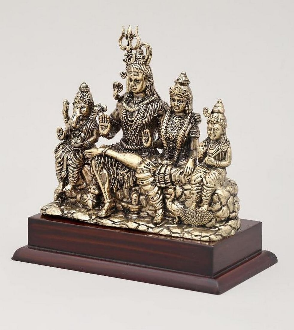 5'' Lord Shiva Family Seated Together on Wooden Base: 5" Lord Shiva Family Seated Together on Wooden Base This 5" brass statue beautifully depicts Lord Shiva with Goddess Parvati and their sons, Lord Ganesha and Lord Kartikeya, seated together in a