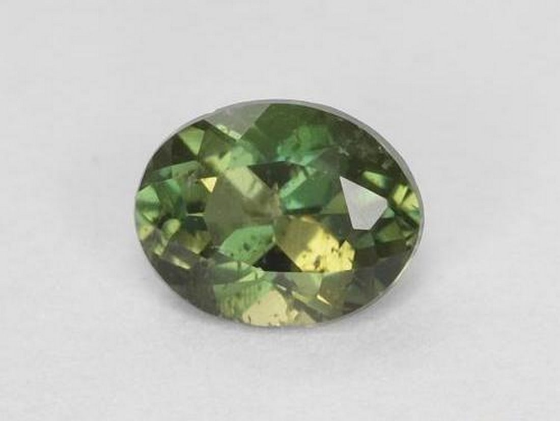 0.31ct Natural Earthy Green Kornerupine, Oval Facet, VS-SI, Sri Lanka: 0.31ct Natural Earthy Green Kornerupine, Oval Facet, VS-SI, Sri Lanka Natural Kornerupine gemstone weighing 0.31 carats, cut in an oval facet shape with an earthy green color and VS-SI clarity. The