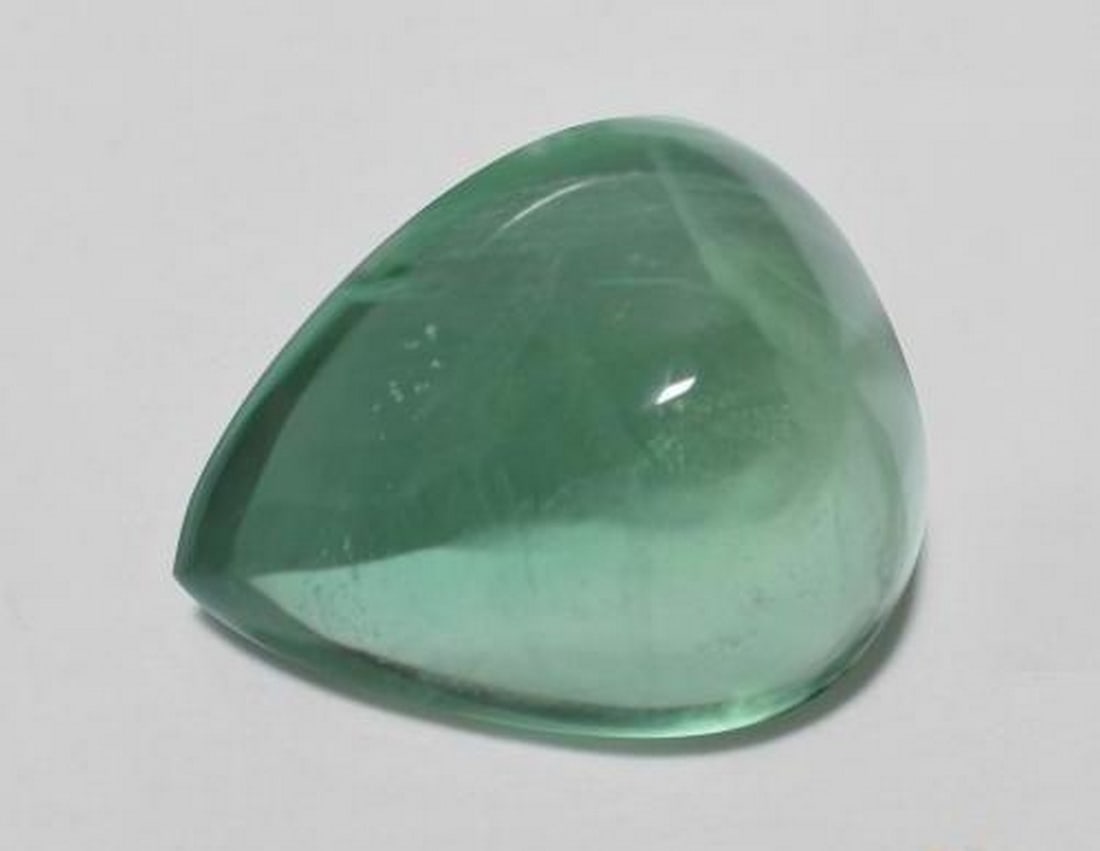 9.31ct Natural Light Cool Green Fluorite, Pear Cabochon, Transparent, India: 9.31ct Natural Light Cool Green Fluorite, Pear Cabochon, Transparent, India Natural Fluorite gemstone weighing 9.31 carats, cut in a pear cabochon shape with a light cool green color and transparent