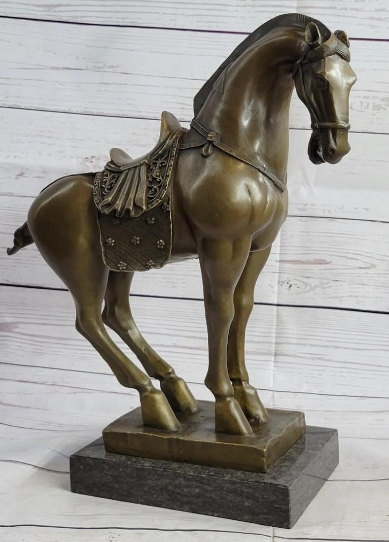 Tang Dynasty Horse Bronze Sculpture: Tang Dynasty Horse Bronze Sculpture Horses are known and loved for their agility, graceful movement, strong bodies and sleek coat. They ignite a feeling of freedom and uncharted paths. This sculpture 