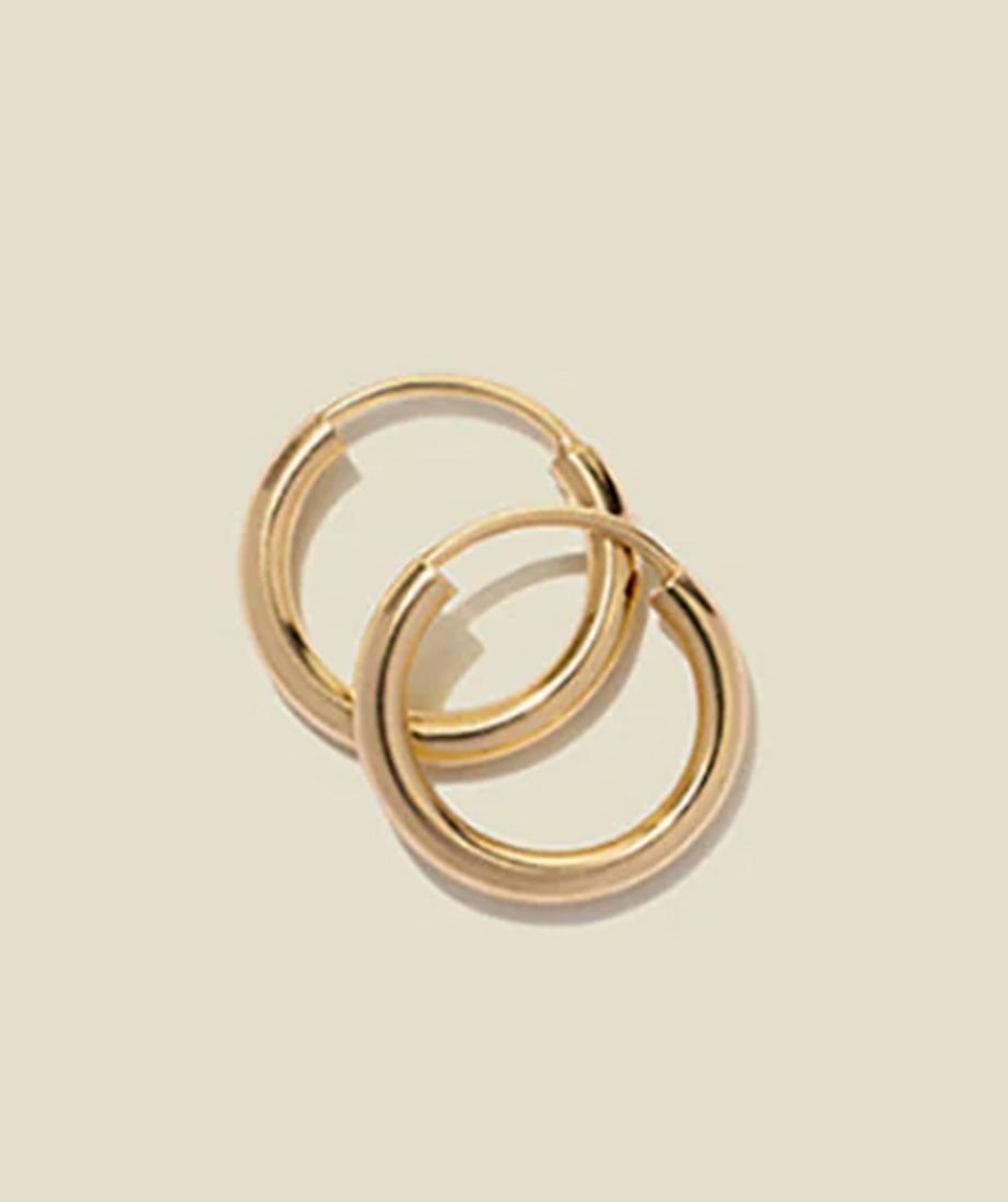14k Solid Gold Mini Live In Hoop Earrings: 14k Solid Gold Mini Live In Hoop Earrings The smallest details make the biggest impact-embrace them with this refined take on our Mini Live-In Hoops. Crafted from 14k solid gold, these delicate