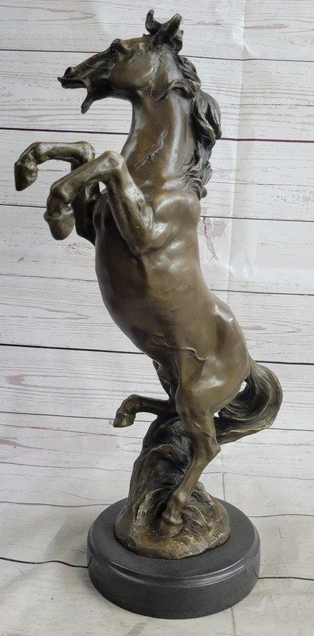 Rearing Stallion Horse Bronze Statue - 18'' x 12'': Rearing Stallion Horse Bronze Statue - 18" x 12" Behold a magnificent sculpture depicting a spirited horse rearing on its hind legs, likely a stallion. In this dynamic pose, the horse emits a re