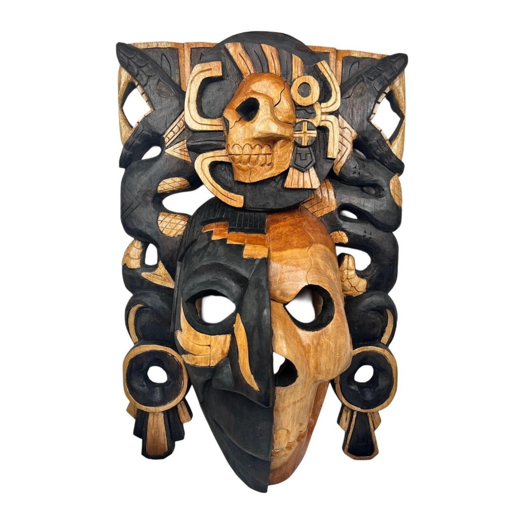 Hand Carved Aztec Life & Death Mask: Hand Carved Aztec Life & Death Mask This handcrafted Mayan mask features a versatile tone that complements any wall color, making it a striking addition to any space. Designed with a dual-face motif, 