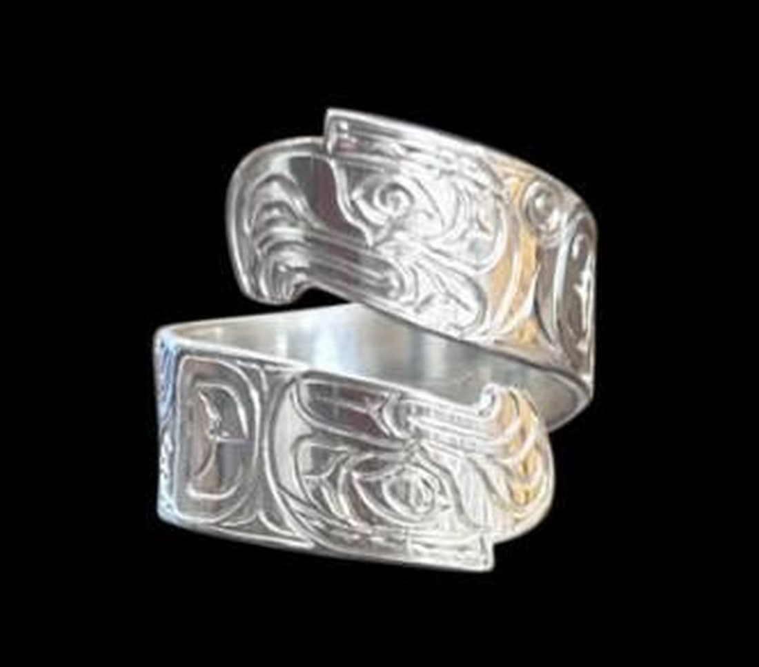 Thunder & Talon Wrap Ring: Thunder & Talon Wrap Ring The Thunder & Talon Wrap Ring embodies the strength and spirit of the sky's most powerful guardians. Crafted in radiant sterling silver, this bold design features a