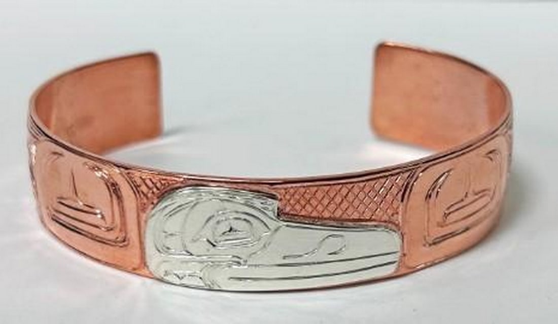 Omen of the Raven Bangle: Omen of the Raven Bangle Forged in warm, lustrous copper, the Omen of the Raven Bangle captures the mystique of the legendary bird. A symbol of wisdom and transformation, the raven is etched in
