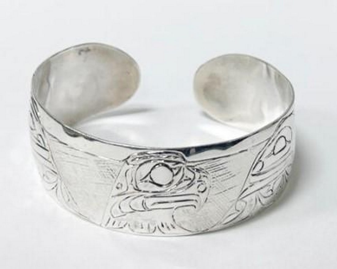 Wings of Majesty Bangle: Wings of Majesty Bangle This sterling silver eagle bangle captures the majesty of the eagle in every detail. Featuring a gracefully sculpted eagle design, the bangle wraps the wrist with strength and
