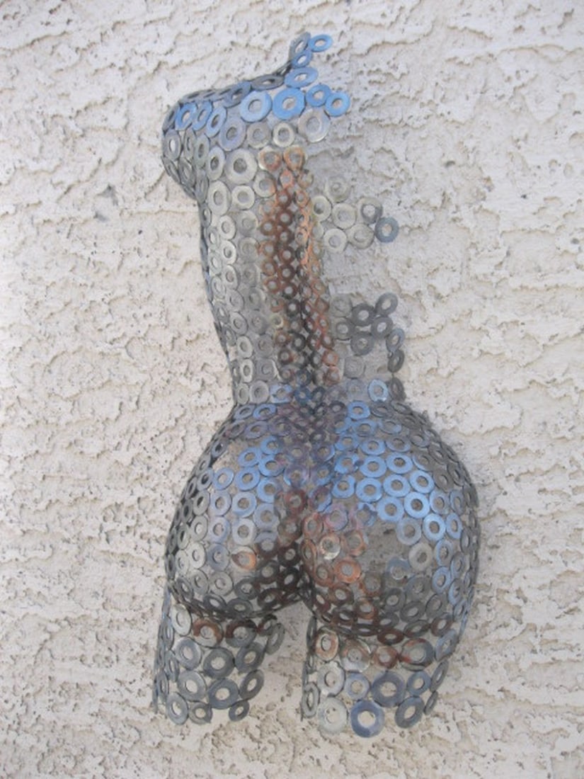 Shattered Elegance Torso Sculpture: Shattered Elegance Torso Sculpture This stunning female torso sculpture captures the essence of transformation, expertly hand-formed and welded with meticulous attention to detail. The fine textured s