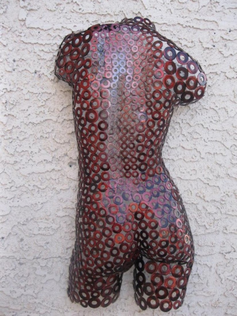 Roxy Metal Sculpture: Roxy Metal Sculpture A bold expression of strength and elegance, Roxy is a handcrafted female torso sculpture shaped and welded with meticulous detail. The polished textures create a dynamic movement 