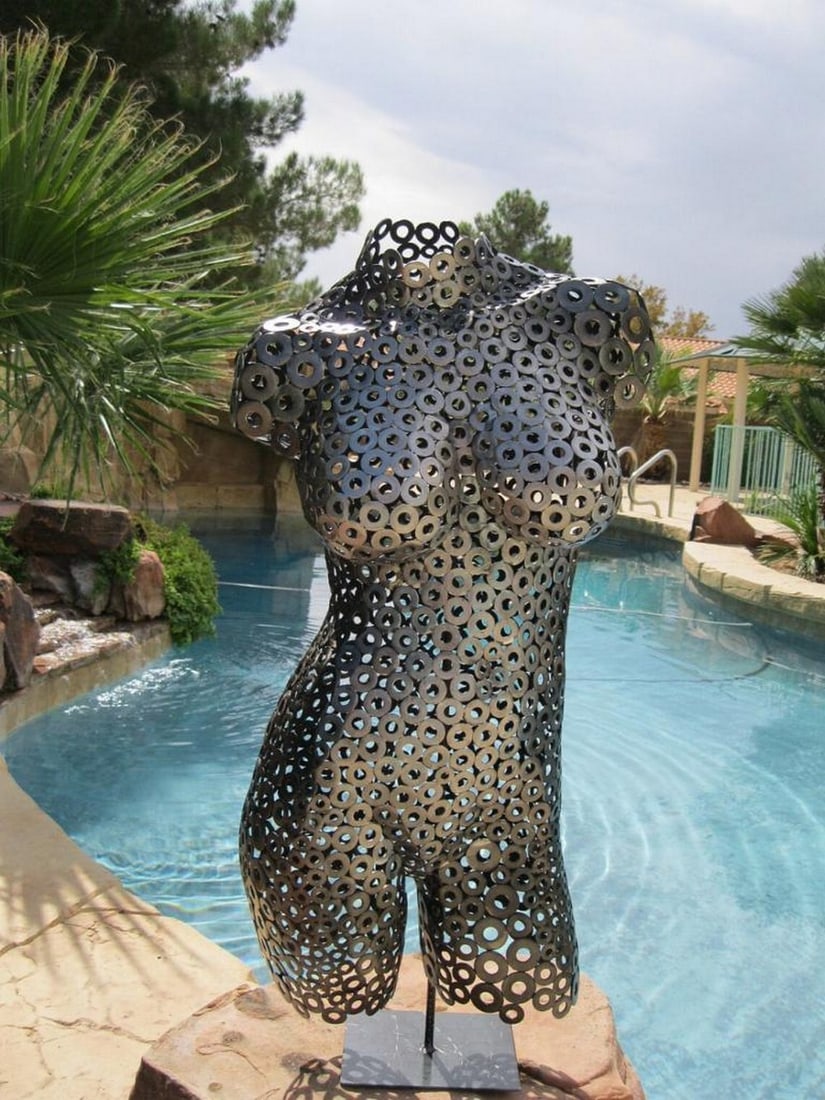 Cherri II Metal Sculpture: Cherri II Metal Sculpture A bold expression of strength and elegance, Cherri II is a full female torso sculpture, meticulously hand-formed and welded. The polished textures create a captivating play o
