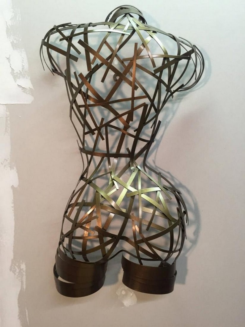 Sara Metal Sculpture: Sara Metal Sculpture A timeless expression of form and texture, Sara is a handcrafted female torso sculpture with a striking silver and pewter finish. The polished surface, achieved through meticulous