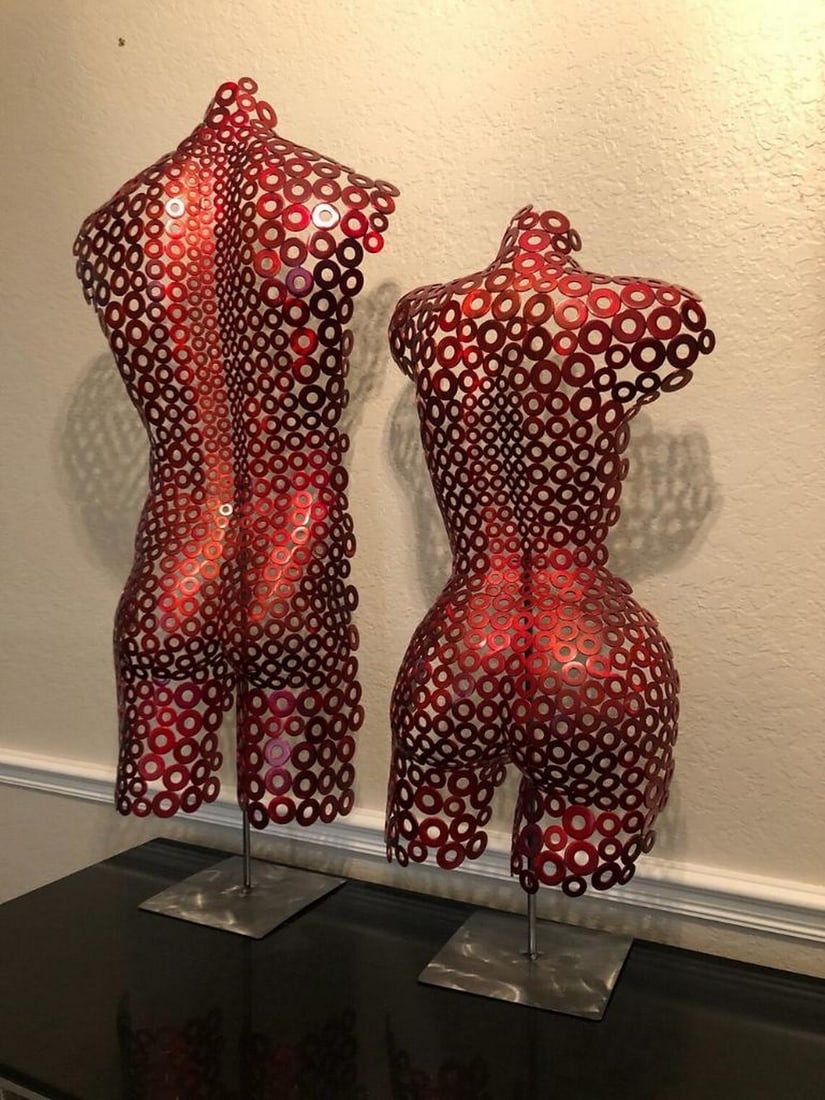 Crimson Unity Metal Sculpture: Crimson Unity Metal Sculpture This striking two-piece metal sculpture captures the harmony of masculine and feminine forms, seamlessly merging into a singular expression of balance and connection. Han
