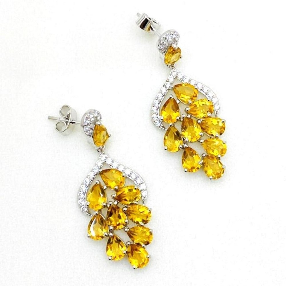 Citrine and Zirconia Studded Earrings: Citrine and Zirconia Studded Earrings These stunning earrings are the perfect accessory to have dangle from your ears. They are bright and perfect to wear in the warm weather. View Photos For Further