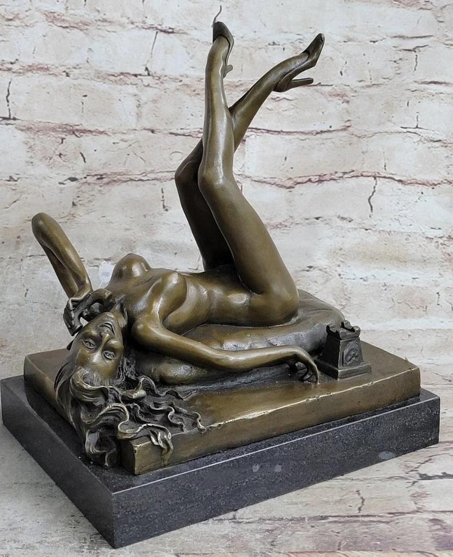 Inspired Nude Woman On Phone Bronze Sculpture - 10'' x 12'': Inspired Nude Woman On Phone Bronze Sculpture - 10" x 12" This pin-up Girl holds a phone while resting fully nude with certain sexy, provocative allure while maintaining that tasteful, classy lo