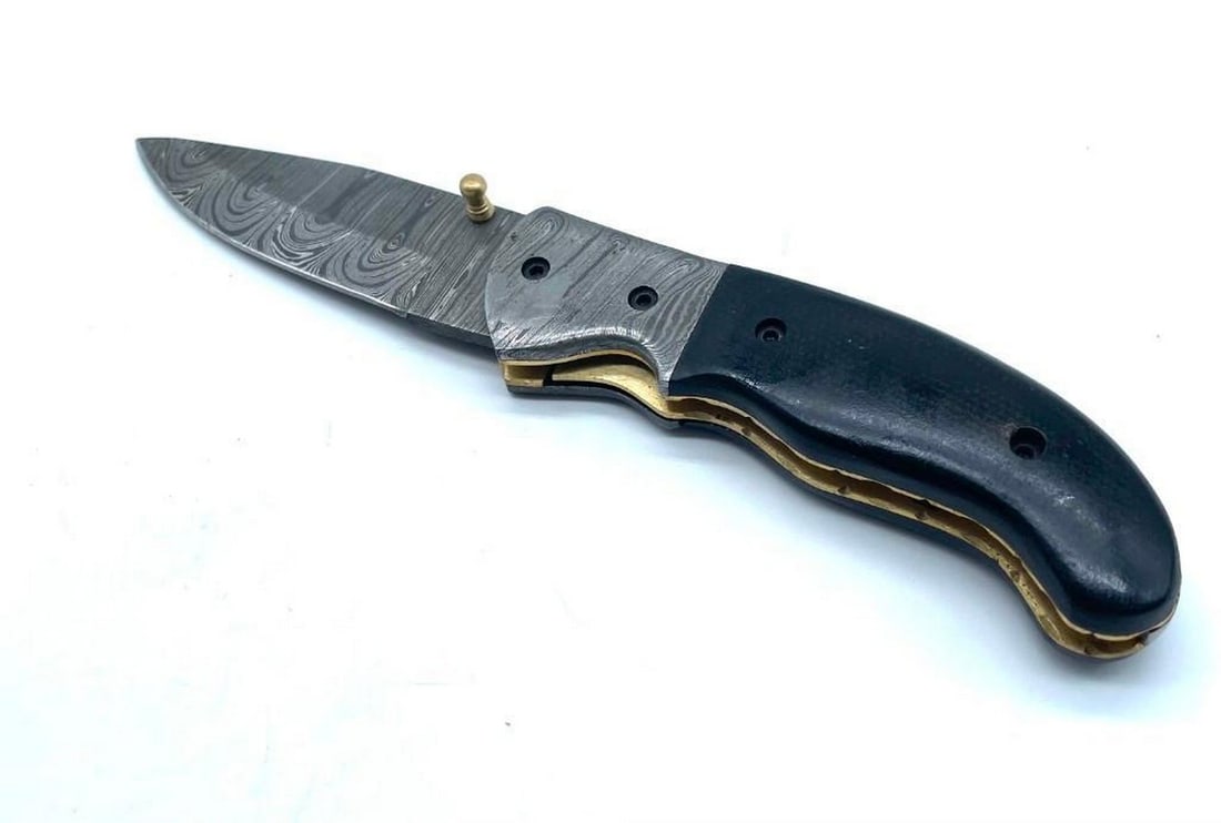 The Last Call Folding Damascus Knife: Custom Handmade Damascus Steel Hunting, Camping & Folding Knife Handle Black Micarata sheath with Damascus bolster. Damascus Steel Blade with 256 Layers on it. HARDNESS 56-60 H R C VERY HIGH QUALITY