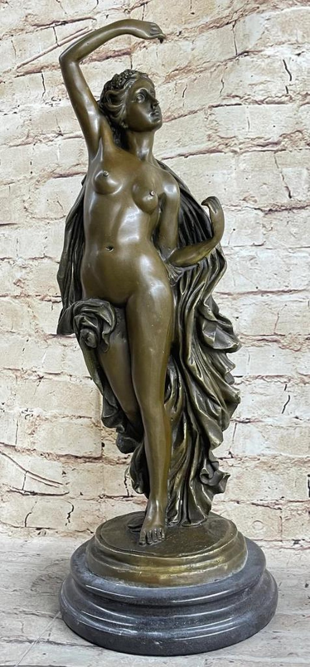 A. Canova Inspired Bronze Sculpture: Graceful Roman Greek Goddess - 20'' x 7'': A. Canova Inspired Bronze Sculpture: Graceful Roman Greek Goddess - 20" x 7" Behold the captivating allure of a bronze sculpture that delicately portrays a Greek goddess in motion. As she gracef