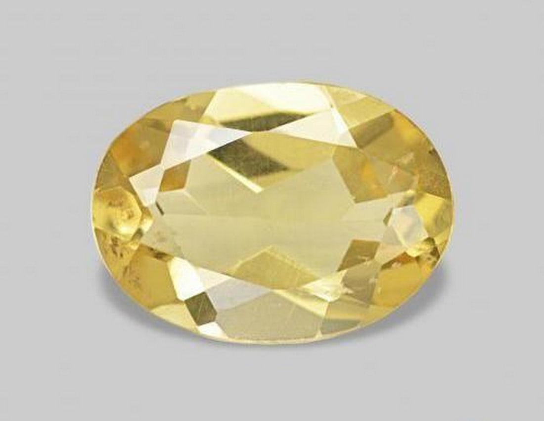 0.89 ct Oval Natural Light Golden-Yellow Beryl: 0.89 ct Oval Natural Light Golden-Yellow Beryl This natural 0.89-carat beryl from Madagascar is cut in an elegant oval faceted shape, displaying a soft light golden-yellow hue with bright, inviting cl