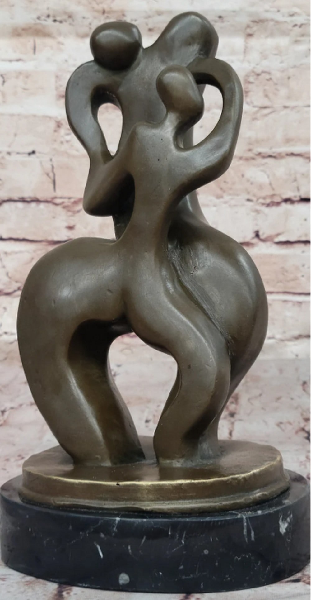 Embracing Figures Abstract Bronze Sculpture: This Abstract Modern Dancer bronze sculpture captures the fluid motion and harmony of a couple intertwined in dance. Signed by the artist Darvish, this piece exhibits a modern, abstract approach, blen
