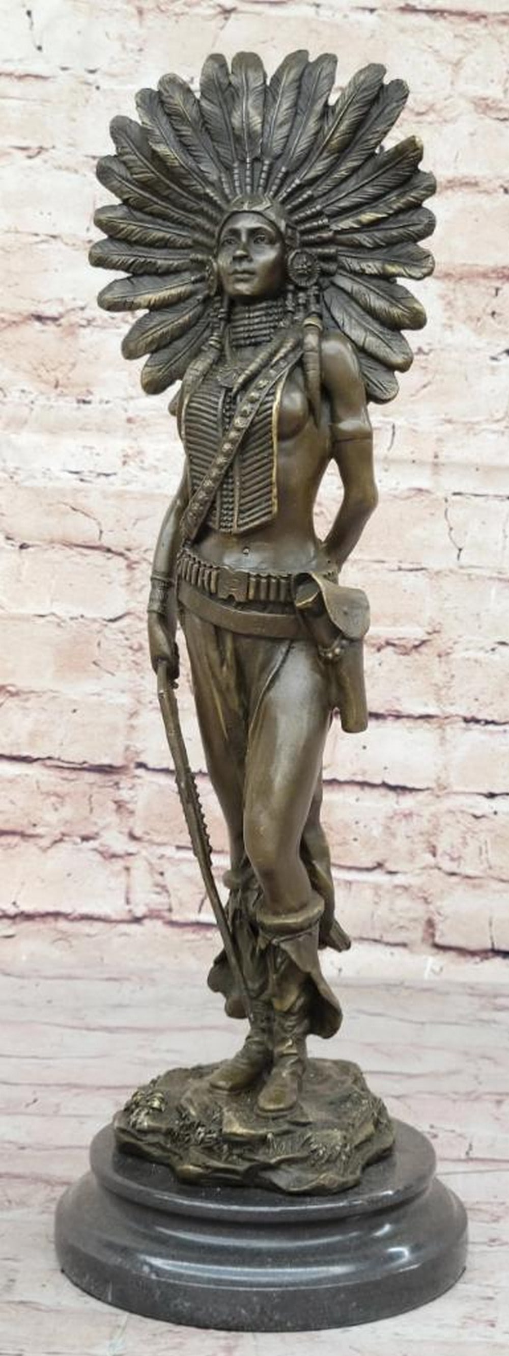 Native American Feathered Headdress Woman Bronze Sculpture - 17'' x 6'': Native American Feathered Headdress Woman Bronze Sculpture - 17" x 6" A fierce Native American women prepares to hunt. She stands tall with bravery, silent confidence and stunning beauty on a 