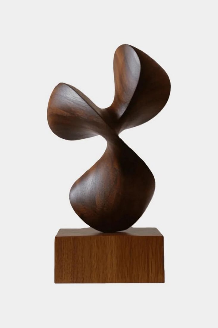 Petal Drift - Organic Flow Wooden Sculpture: Petal Drift - Organic Flow Wooden Sculpture A dynamic wooden sculpture that captures the essence of movement and natural elegance. With three curved, petal-like extensions converging at the center,