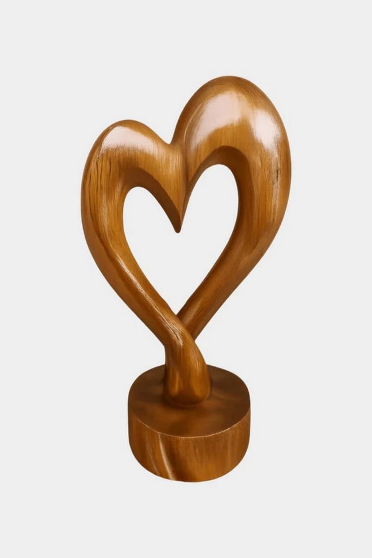 Heartline Harmony' Wooden Abstract Sculpture: 'Heartline Harmony' Wooden Abstract Sculpture An elegant wooden sculpture shaped into a stylized heart, merging fluid curves into a single base atop a circular pedestal. The minimalist design evokes