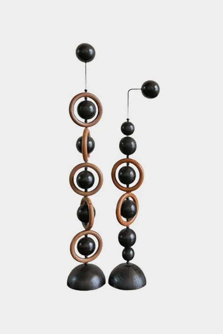 Orbital Balance: Contemporary Wooden Sculpture Duo: Orbital Balance: Contemporary Wooden Sculpture Duo This striking pair of modern wooden sculptures blends geometric precision with organic warmth. Each piece features a series of jet-black spheres