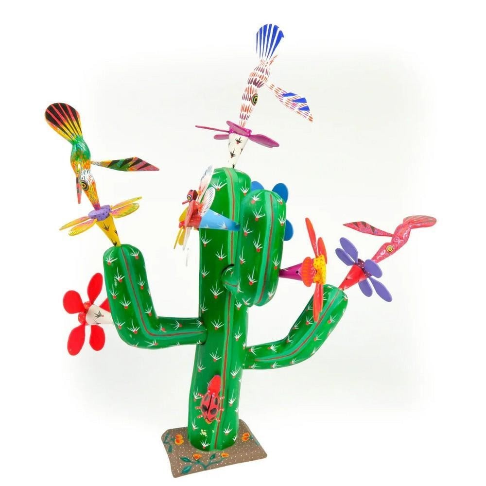 Flowering Cactus with Hummingbirds - Oaxacan Alebrije Wood Carving: Flowering Cactus with Hummingbirds - Oaxacan Alebrije Wood Carving This vibrant and imaginative cactus sculpture bursts with life, featuring blooming flowers and delicate hummingbirds in motion. Hand-