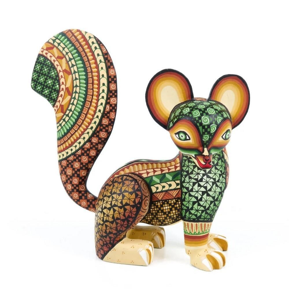 Zapotec Spirit Fox - Hand-Carved Oaxacan Alebrije by the Fuentes Family: Zapotec Spirit Fox - Hand-Carved Oaxacan Alebrije by the Fuentes Family This striking fox alebrije is a vibrant testament to Oaxacan tradition and craftsmanship, meticulously hand-carved by the renown