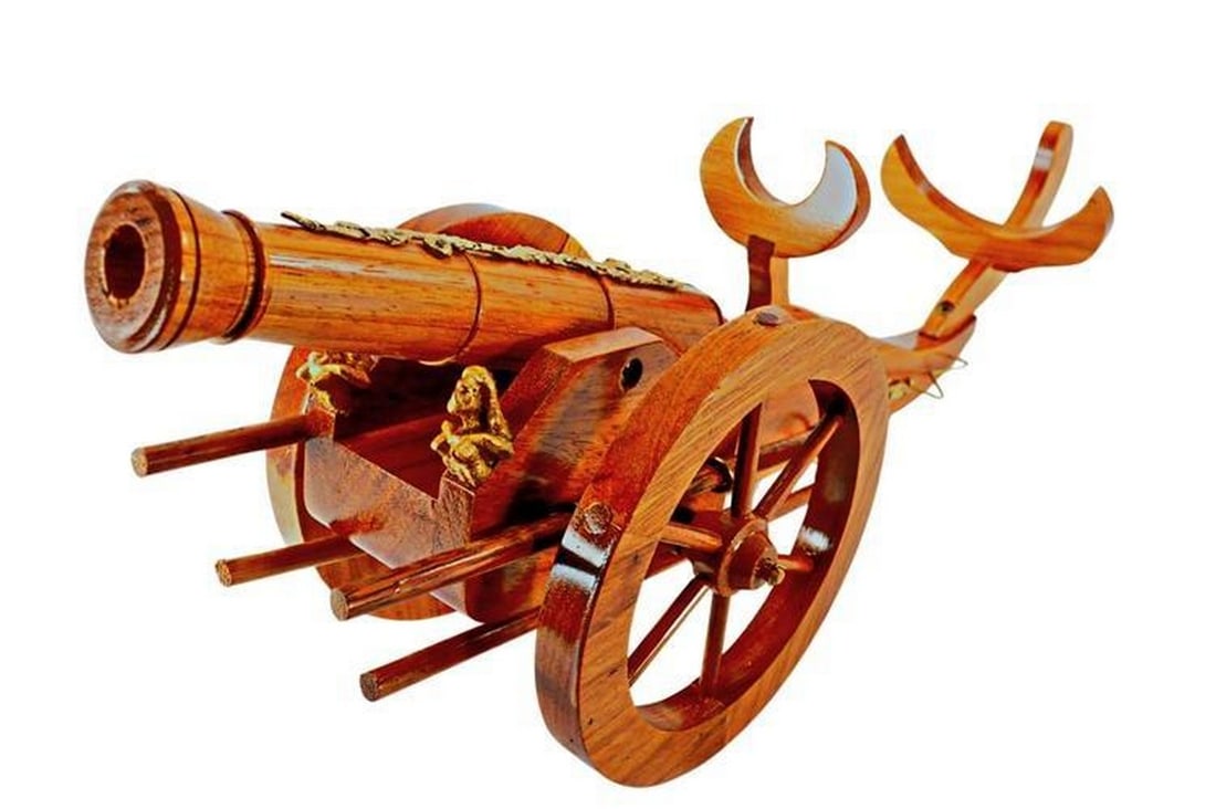 Cannon Shooter Wooden Replica Wine Bottle Holder: Cannon Shooter Wooden Replica Wine Bottle Holder This stunning replica of a Civil War cannon shooter doubles as a wine holder. It will display your favorite or best wine in the house! This