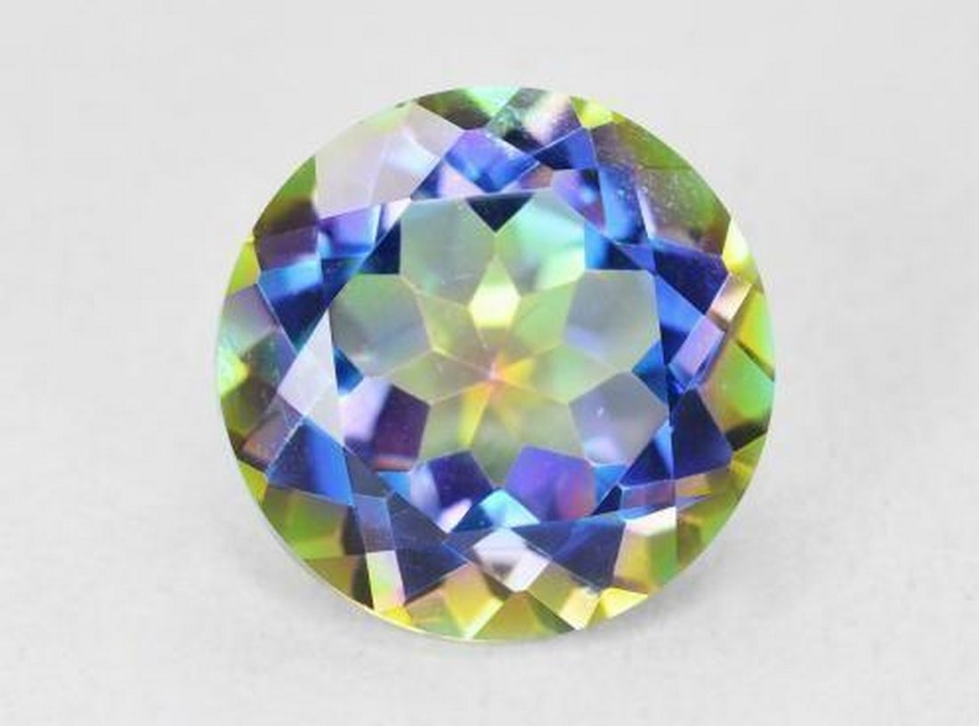 3.58ct Round Cut Mystic Quartz: 3.58ct Round Cut Mystic Quartz Specifications: Type: Mystic Quartz Weight: 3.58 ct Size: 10 mm Shape: Round Facet Color: Multicolor Clarity: VVS-VS Treatment: Coated Origin: Brazil View photos for