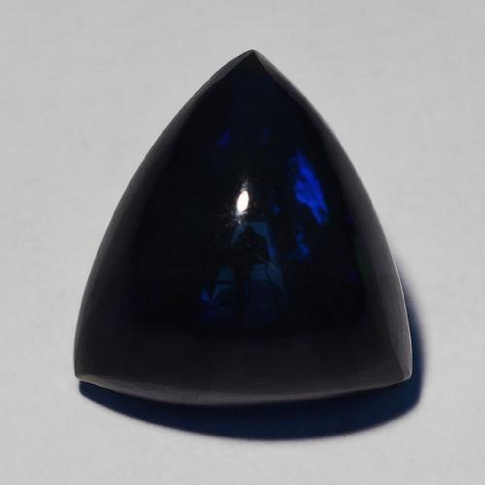 6.27 ct Trillion Cabochon Midnight Starry Night Black Opal Gemstone: 6.27 ct Trillion Cabochon Midnight Starry Night Black Opal Gemstone Introducing the ethereal Trillion Cabochon Midnight Starry Night Black Opal Gemstone - a true masterpiece that encapsulates the magi