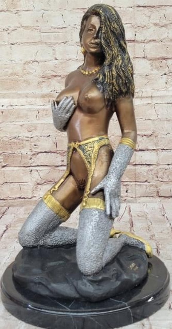 Limited Edition 8 of 100 Bronze Erotic Sculpture: Limited Edition 8 of 100 Bronze Erotic Sculpture Handcrafted using the traditional lost wax method, this sculpture captures the graceful and alluring pose of a nude woman adorned with a garter belt. A