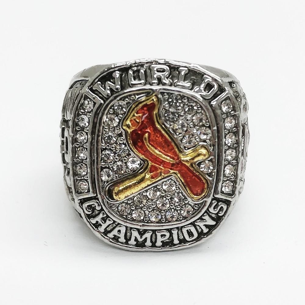 2011 St. Louis Cardinals - MLB Championship Inspired Ring: 2011 St. Louis Cardinals - MLB Championship Inspired Ring. A Red Enameled Perching Cardinal Faces The Stone Crusted Silver Colored Ring. One Of The Nicest Designs For A Champions Ring. View Photos For