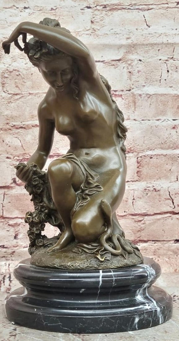 Jean Patoue Original Nude Woman Holding Rose Bronze Sculpture - 11'' x 6'': Jean Patoue Original Nude Woman Holding Rose Bronze Sculpture - 11" x 6" This original bronze sculpture depicts a nude woman in a serene, natural pose, gently holding a rose. The figure emphas