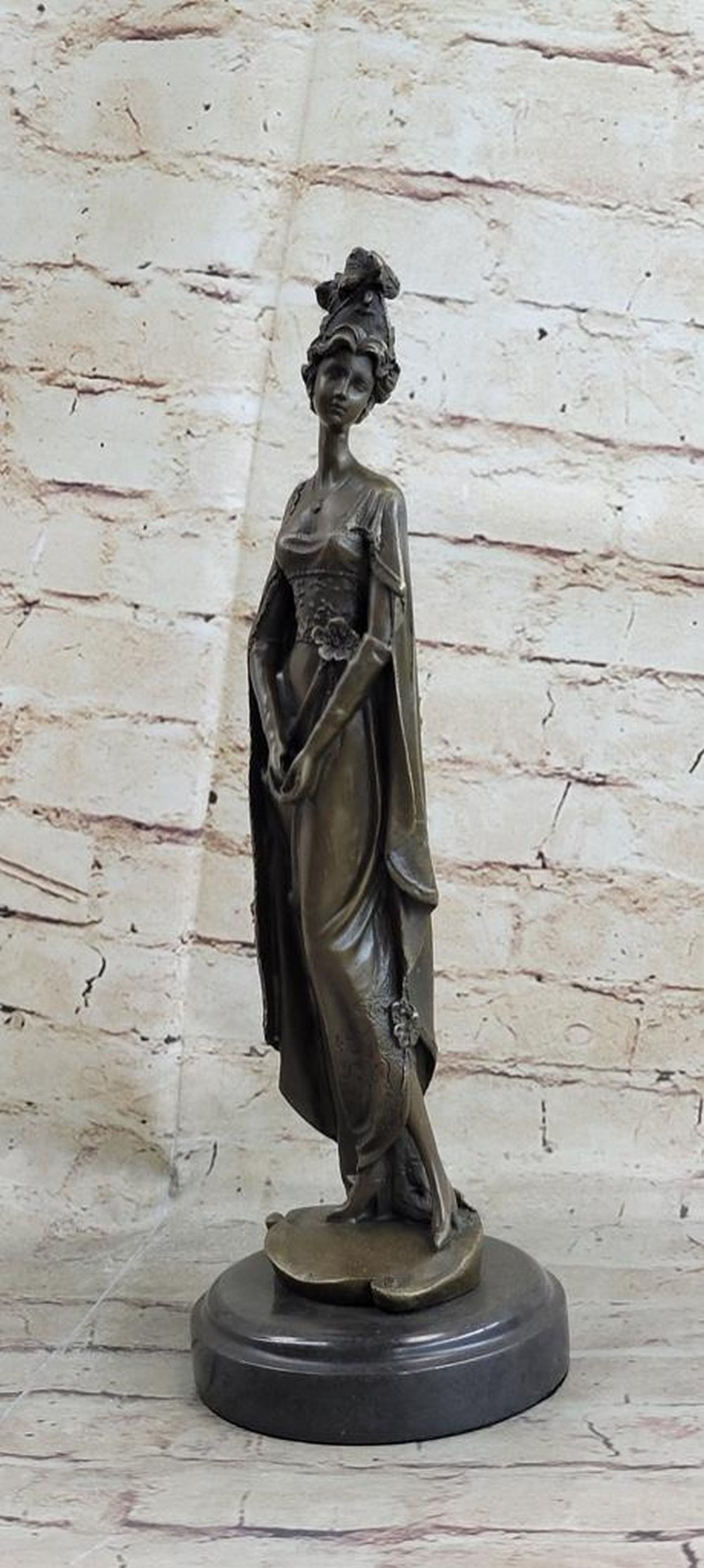 Classic Victorian Woman Bronze Statue on a Marble Base: Classic Victorian Woman Bronze Statue on a Marble Base. This unique sculpture of a 1920x96 s woman with four feathers in her right hand standing proudly for the silent era. Her unforgettable dress tha