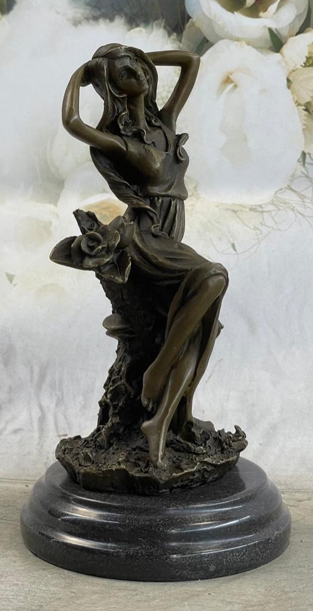 Flower Blossom Nymph Girl Bronze Statue: Flower Blossom Nymph Girl Bronze Statue This beautiful woman sits in the mist of a gorgeous flower garden and picked a bunch of different once for her home. She has this amazing long yet sexy dress, t